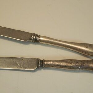 A pair of : 1 Birks Sterling , 1 no name Flatware Knives